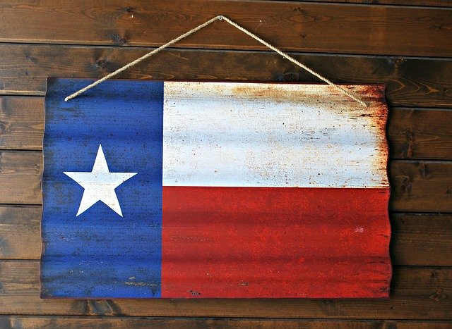 Texas Flag on wooden background